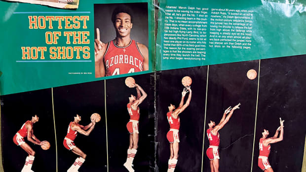 Former Arkansas assistant coach Matt Zimmerman's childhood wall featuring several basketball articles and a spread of former Razorback basketball star Marvin Delph.